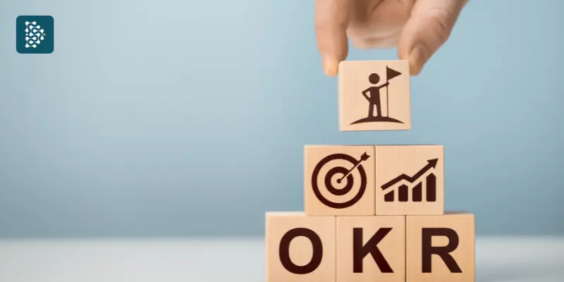dados mostrando letras OKR